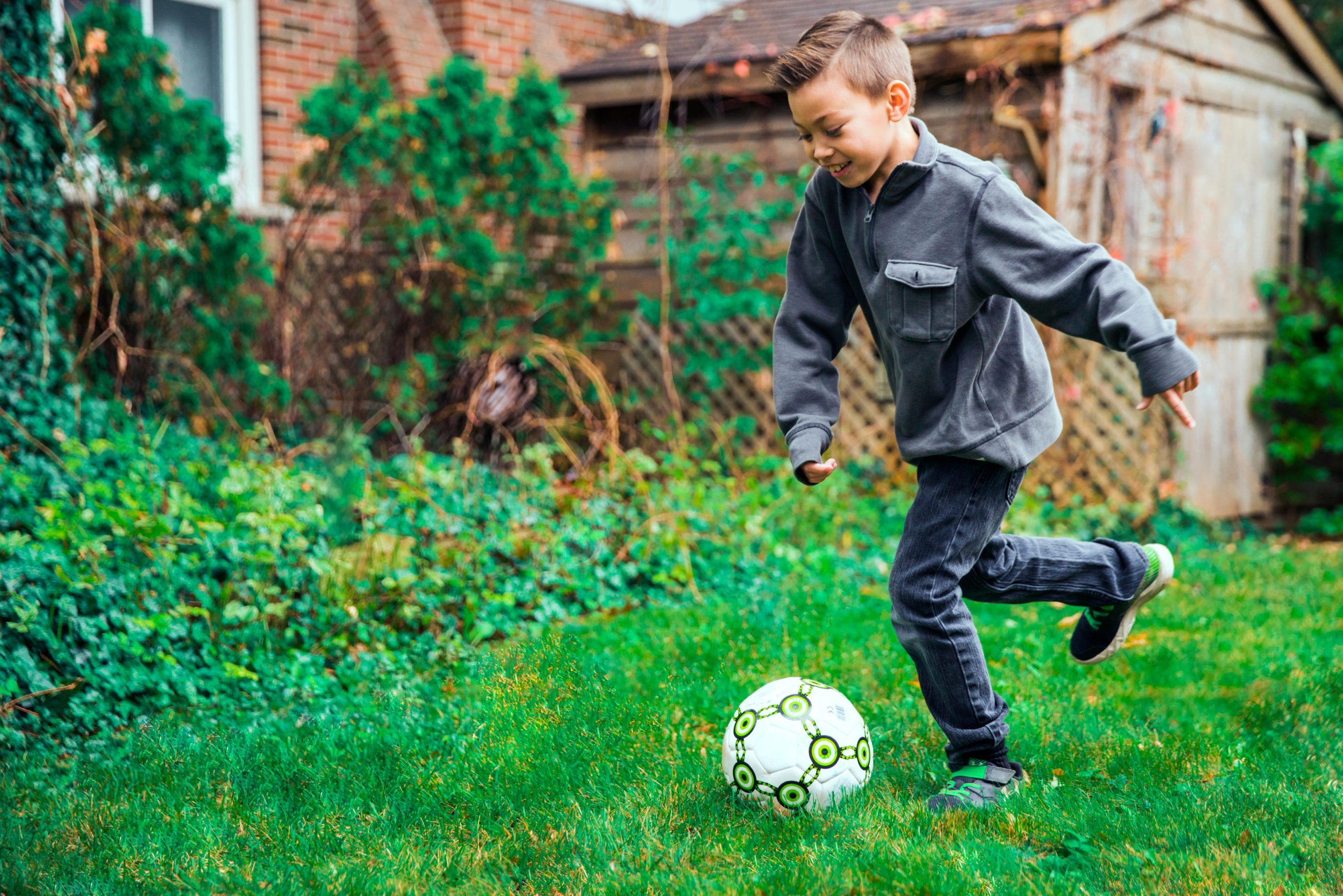 young-boy-kicking-ball